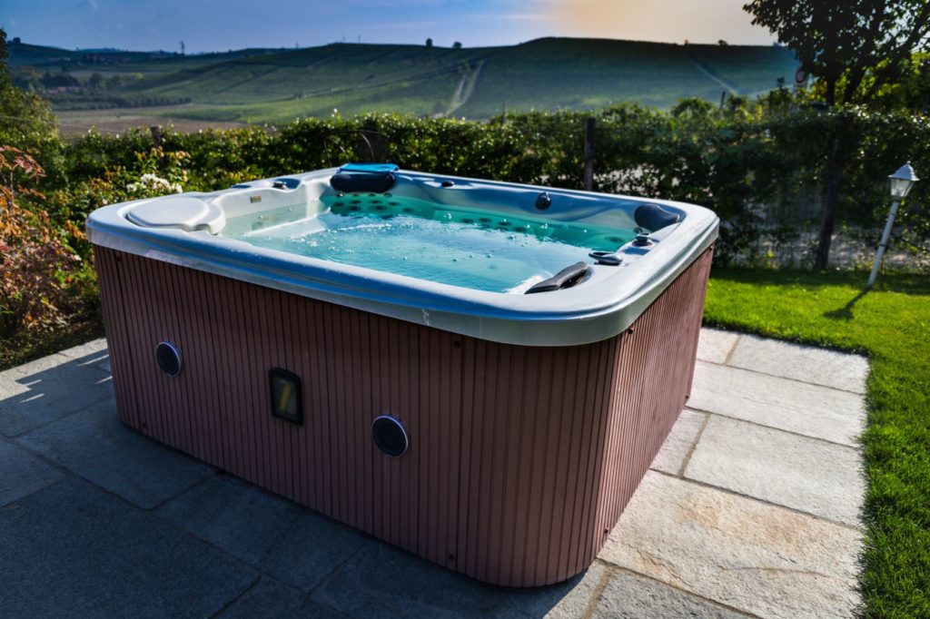 hot tub in a small backyard